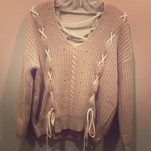 Nanamacs boutique cable knit lace up sweater.